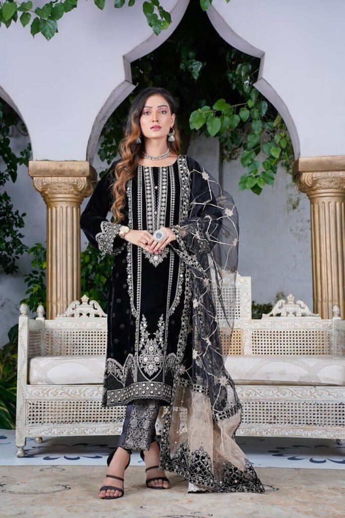 Traditional Pakistani fashion portrait featuring ornate embroidered dress.